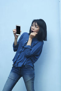 Young woman using mobile phone