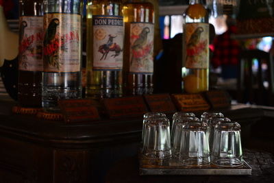 Close-up of glass bottles on table