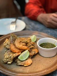 Prawns with basil sauce in a plate