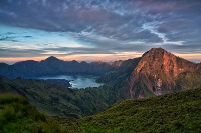 Scenic view of mountains against cloudy sky