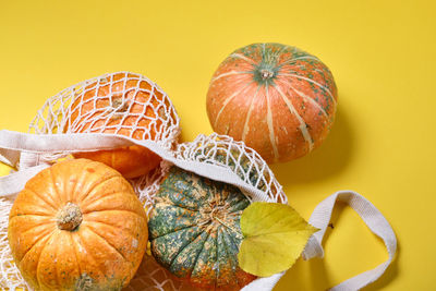 Close-up of pumpkin against yellow background