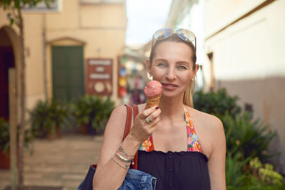 Portrait of mature woman eating ice cream