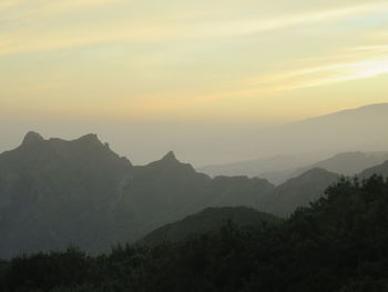 Scenic view of mountains at sunset