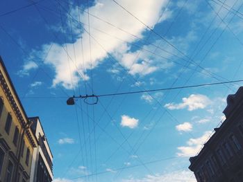 Low angle view of building against cloudy sky