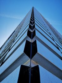 Low angle view of modern building against clear blue sky