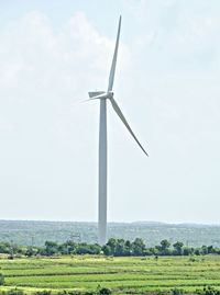 Windmill against sky