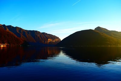 Scenic view of mountains against blue sky