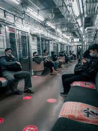 High angle view of people sitting in train