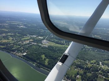 Aerial view of landscape seen through airplane window