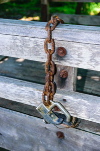 Close-up of padlock on rusty chain