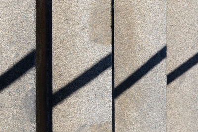 Close-up of shadow on tiled floor