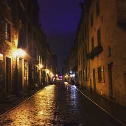 Empty road in old town at night