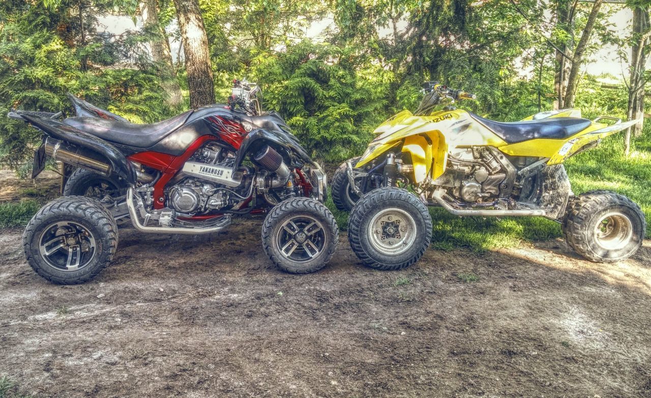 land vehicle, transportation, mode of transport, car, tree, stationary, abandoned, parked, street, field, day, outdoors, sunlight, road, travel, motorcycle, parking, tractor, wheel, old