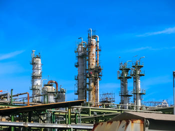 Plant petrochemical in the daytime with copy space on top.