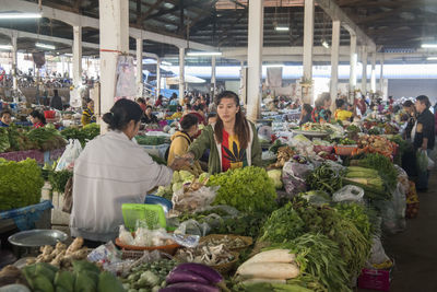 People at market stall