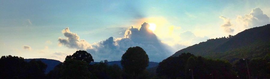 Scenic view of mountains against cloudy sky