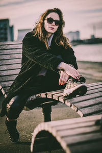 Portrait of woman sitting outdoors