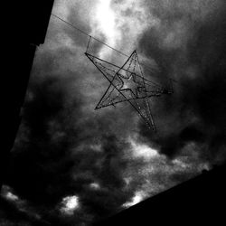Low angle view of silhouette tree against sky