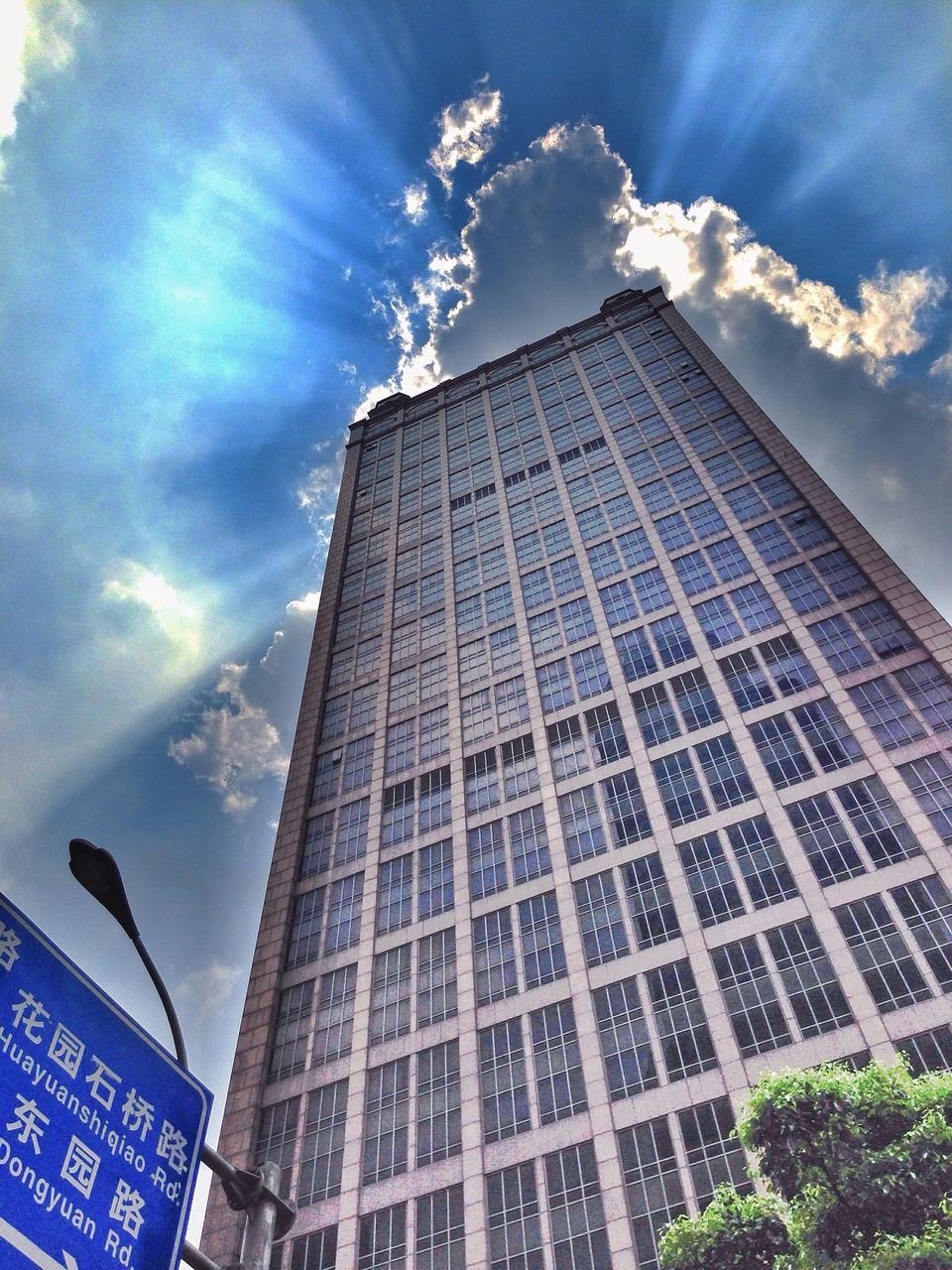 building exterior, low angle view, architecture, built structure, sky, cloud - sky, city, modern, building, tall - high, office building, cloud, tower, cloudy, day, window, glass - material, outdoors, skyscraper, no people