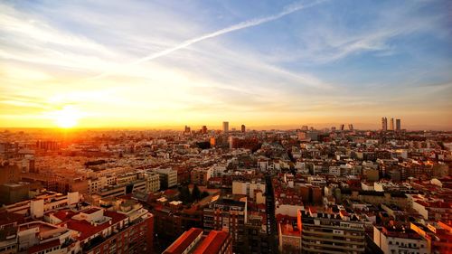 High angle view of buildings against sky during sunset