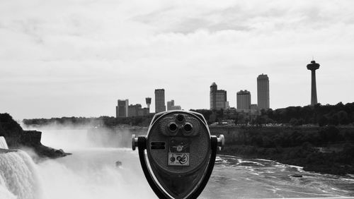 Coin-operated binoculars at niagara falls against sky