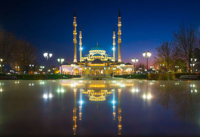 Reflection of illuminated buildings in water at night