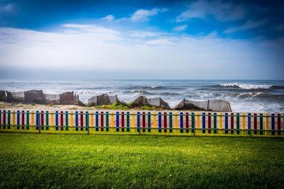 Scenic view of sea against cloudy sky