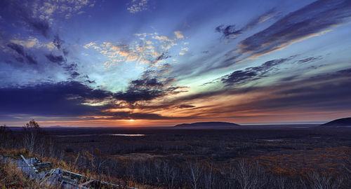 Scenic view of landscape against sky during sunset