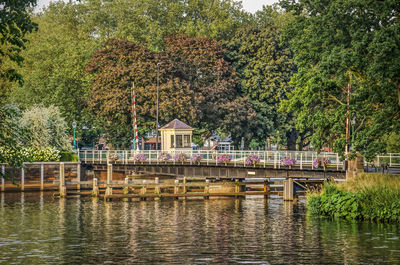 Pedestrian bridge across a dutch canal in summer