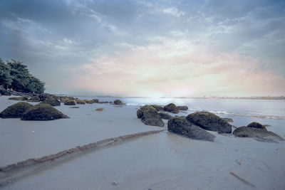 Scenic view of sea against sky at sunset