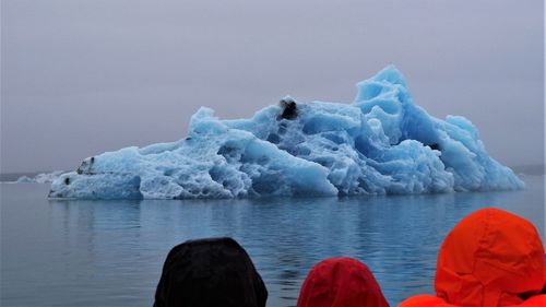 Frozen lake against sky during winter