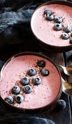 High angle view of yogurt in bowls on table