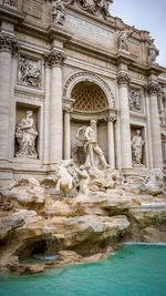 Statue in front of historical building