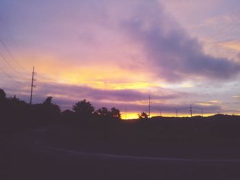 Silhouette landscape against scenic sky