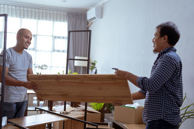 Side view of man working at home