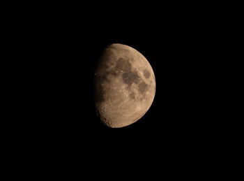 Low angle view of moon against sky at night