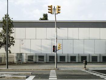 Road by building against sky