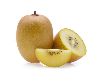 Close-up of kiwis against white background