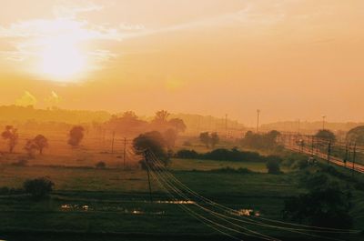 Scenic view of landscape at sunset