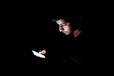 Man in black background