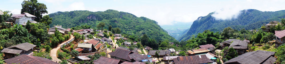 High angle view of townscape and trees against sky