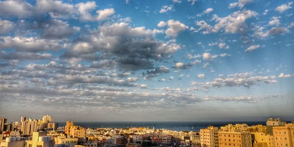 High angle view of buildings in city against sky