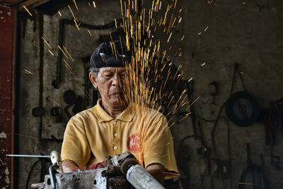 Man working on metal structure
