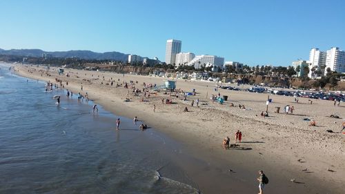 People at beach in city