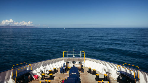 High angle view of boats in sea against blue sky