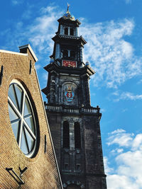 Low angle view of clock tower against sky