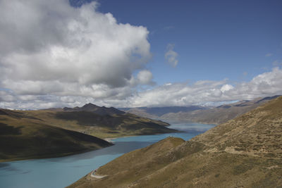 Scenic view of lake and mountains against sky