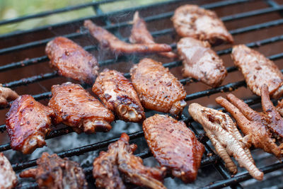 Close-up of meat on barbecue grill