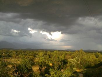 Scenic view of landscape against cloudy sky