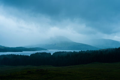 Scenic view of landscape and mountains against sky